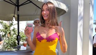 Hailey Bieber flaunts a revealing nightgown in the desert, earning her the title of 'First Lady' at this year's Coachella.