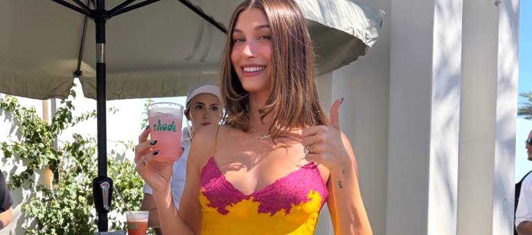 Hailey Bieber flaunts a revealing nightgown in the desert, earning her the title of 'First Lady' at this year's Coachella.