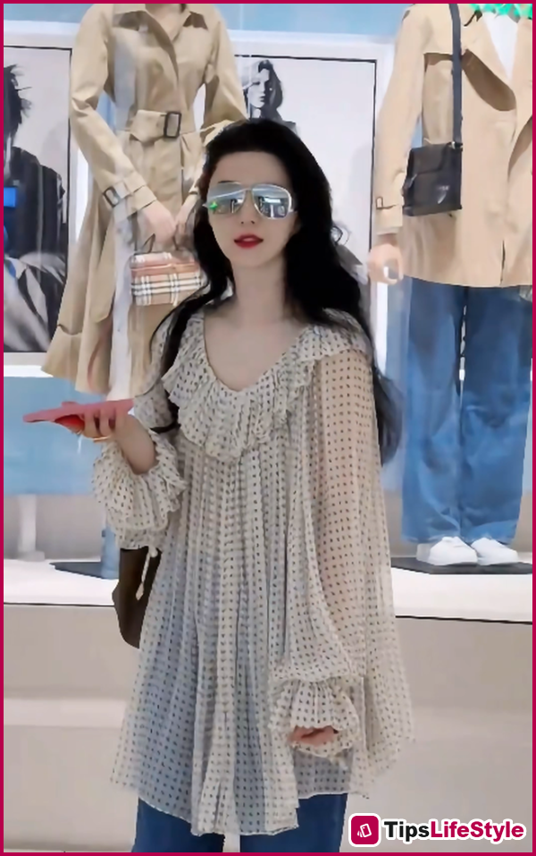 images 1 of At 45, Fan Bingbing still effortlessly pulls off ruffled blouses with exquisite elegance.