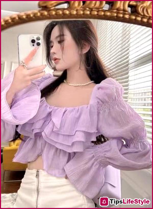 images 2 of At 45, Fan Bingbing still effortlessly pulls off ruffled blouses with exquisite elegance.
