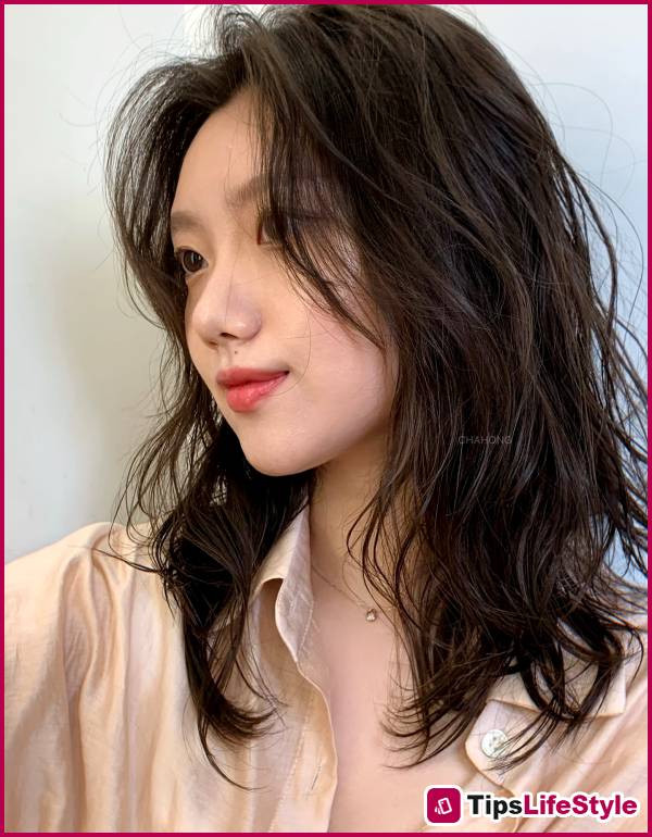 images 4 of 5 lightweight, shoulder-length hairstyles for those tired of long hair but hesitant to cut it short.